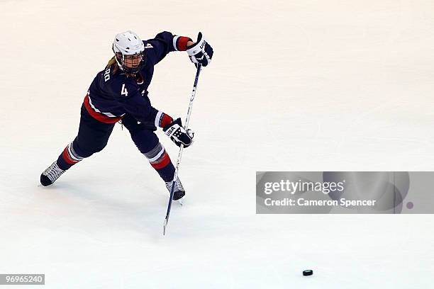 Angela Ruggiero of the United States moves the puck against Sweden during the ice hockey women's semifinal game game between on day 11 of the...