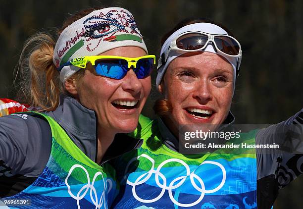 Claudia Nystad and Evi Sachenbacher-Stehle of Germany celebrate crossing winning the gold medal in the cross country skiing ladies team sprint final...