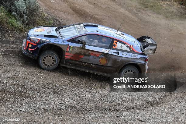 Belgian driver Thierry Neuville and compatriot co-driver Nicolas Gilsoul steer their Hyundai i20 Coupe WRC, near Castelsardo village, on the second...