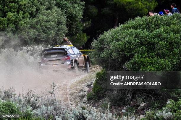 French driver Sebastien Ogier and co-driver Julien Ingrassia drive their Ford Fiesta WRC, near Castelsardo village, on the second day of the 2018 FIA...