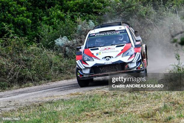 Finnish driver Esapekka Lappi and co-driver Janne Ferm steer their Toyota Yaris WRC, near Castelsardo village, on the second day of the 2018 FIA...