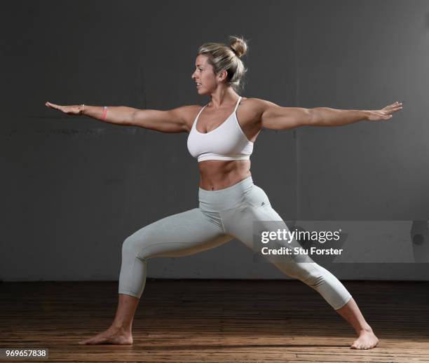 Yoga teacher and Wales and Ospreys Rugby Union player Alecs Donovan pictured demonstrating a Warrior II/ Virabhadrasana pose during a Yoga session at...