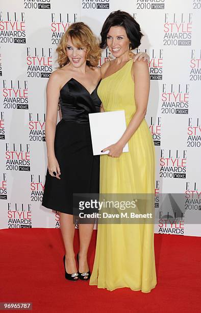 Dannii Minogue poses with the TV Star Award presented by Kylie Minogue during the ELLE Style Awards 2010, at the Grand Connaught Rooms on February...