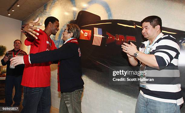 United States Olympic gold medal speed skater Shani Davis presents his two coaches Ryan Shimabukuro and Jimmy Jang with the medal for Order of Ikkos...