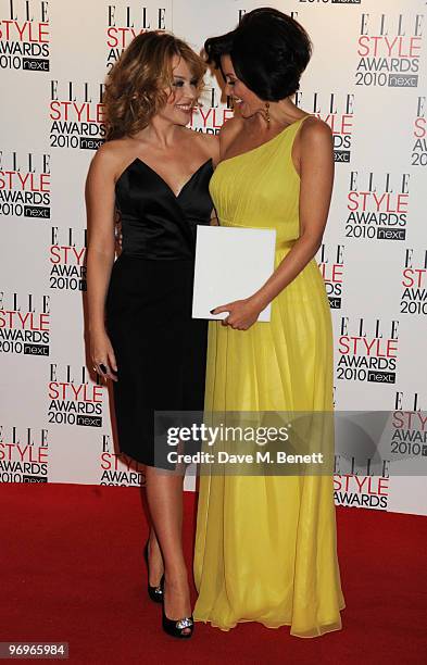 Dannii Minogue poses with the TV Star Award presented by Kylie Minogue during the ELLE Style Awards 2010, at the Grand Connaught Rooms on February...