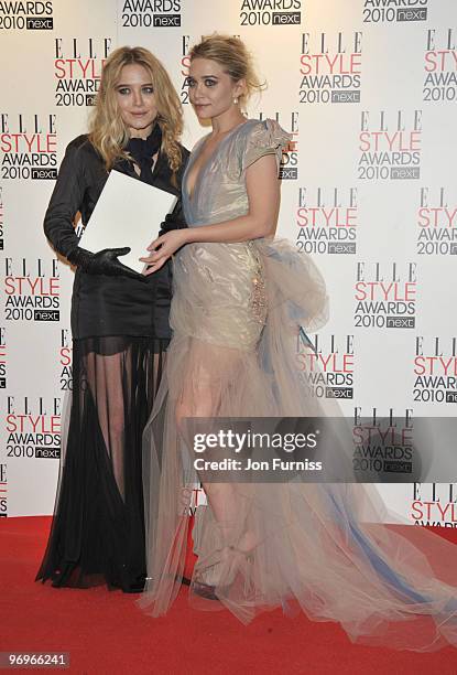 Ashley Olsen and Mary-Kate Olsen pose in the winners room at the ELLE Style Awards at Grand Connaught Rooms on February 22, 2010 in London, England.