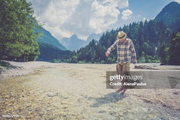 senior man in alps - barefoot snow stock pictures, royalty-free photos & images