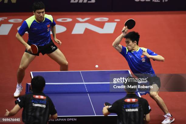 Jingkun Liang and Kai Zhou of China compete against Tomokazu Harimoto and Yuto Kizukuri of Japan during the men's doubles match on day one of the...