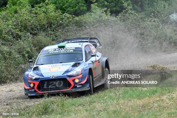 Hayden Paddon from New Zealand and British co-driver Sebastian Marshall steer their Hyundai N i20 Coupe WRC, near Castelsardo village, on the second...