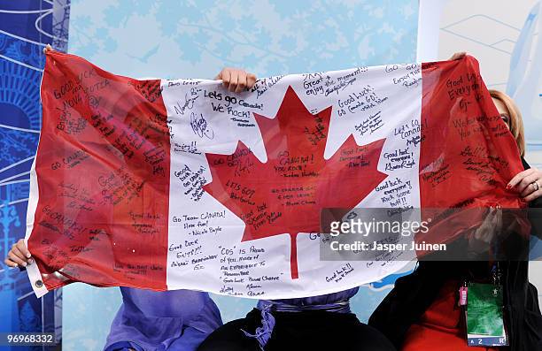 Vanessa Crone and Paul Poirier of Canada are seen in the kiss and cry area after they competed in the free dance portion of the Ice Dance competition...