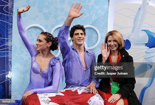 Vanessa Crone and Paul Poirier of Canada are seen in the kiss and cry area after they competed in the free dance portion of the Ice Dance competition...