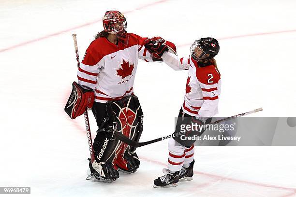 Shannon Szabados of Canada celebrates with Meghan Agosta after a goal against Finland during the ice hockey women's semifinal game on day 11 of the...