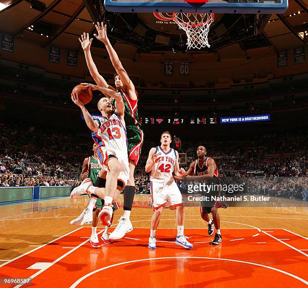 Sergio Rodriguez of the New York Knicks shoots against Andrew Bogut of the Milwaukee Bucks on February 22, 2010 at Madison Square Garden in New York...