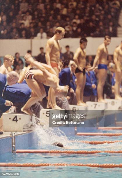 Swimmers dive into the water in the Men's 4x200 Meter Relay. The U.S. Placed first in this event.