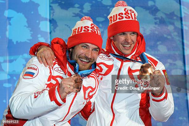 Alexey Petukhov and Nikolay Morilov of Russia receive the bronze medal during the medal ceremony for the men's team sprint cross-country skiing on...