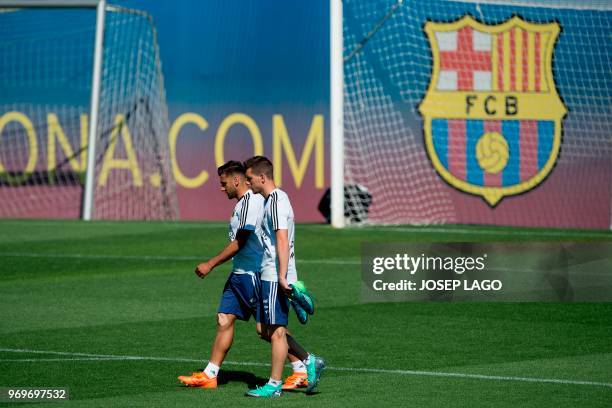 Argentina's midfielder Eduardo Salvio and Argentina's midfielder Giovani Lo Celso attend a training session at the FC Barcelona 'Joan Gamper' sports...
