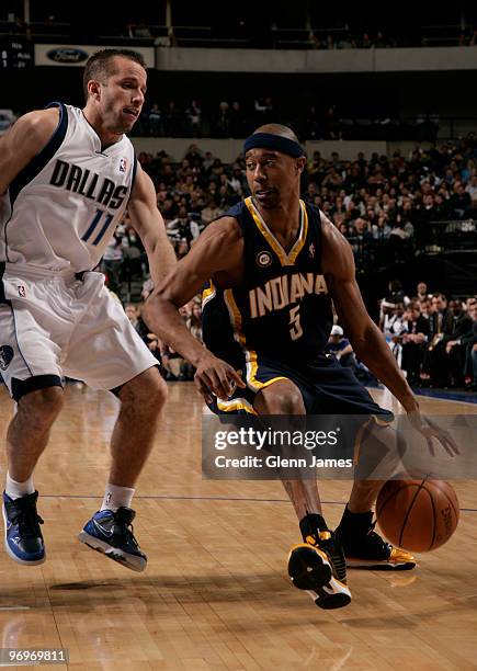 Ford of the Indiana Pacers drives against Jose Juan Barea of the Dallas Mavericks during a game at the American Airlines Center on February 22, 2010...