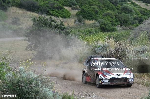 Finnish driver Esapekka Lappi and co-driver Janne Ferm steer their Toyota Yaris WRC, near Castelsardo village, on the second day of the 2018 FIA...