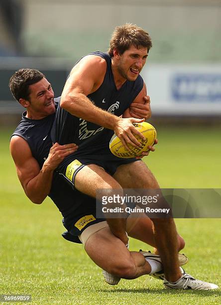 Jarrad Waite of the Blues is tackled by Mark Austin during a Carlton Blues AFL training session at Visy Park on February 23, 2010 in Melbourne,...