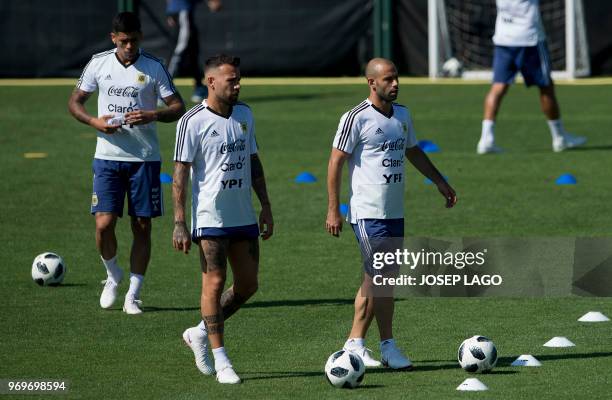 Argentina's midfielder Javier Mascherano defender Nicolas Otamendi attend a training session at the FC Barcelona 'Joan Gamper' sports center in Sant...