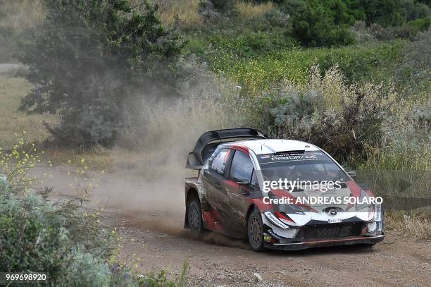 Estonia's driver Ott Tanak steers his Toyota Yaris WRC with his co-driver Martin Jarveoja, near Castelsardo village, on the second day of the 2018...