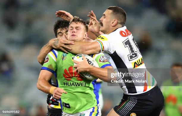 Regan Campbell-Gillard of the Panthers tackles Liam Knight of the Raiders high during the round 14 NRL match between the Canberra Raiders and the...