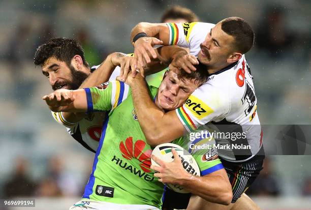 Regan Campbell-Gillard of the Panthers tackles Liam Knight of the Raiders high during the round 14 NRL match between the Canberra Raiders and the...