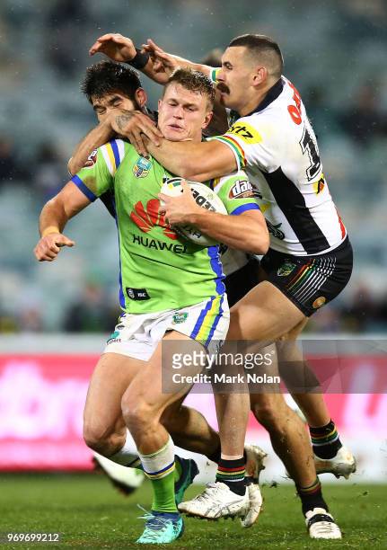 Regan Campbell-Gillard of the Panthers tackles Liam Knight of the Raiders high during the round 14 NRL match between the Canberra Raiders and the...