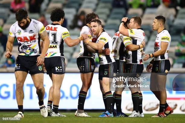 James Maloney of the Panthers celebrates with team mates after winning the round 14 NRL match between the Canberra Raiders and the Penrith Panthers...