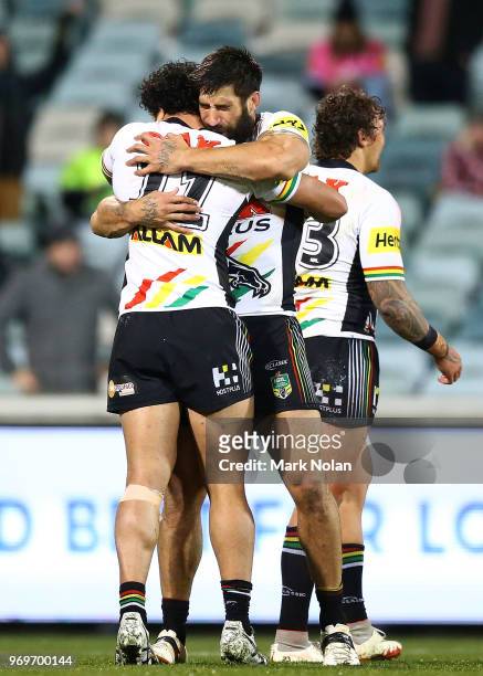 Corey Harawira-Naera and James Tamou of the Panthers celebrate after winning the round 14 NRL match between the Canberra Raiders and the Penrith...