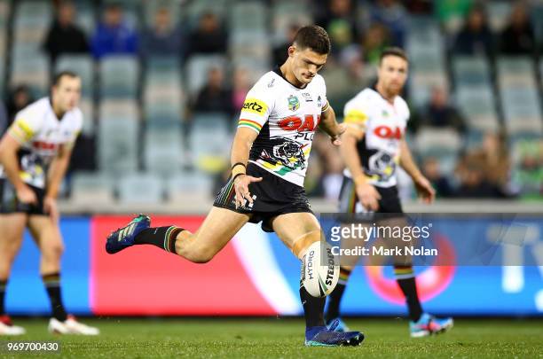 Nathan Cleary of the Panthers kicks a field goal to win the round 14 NRL match between the Canberra Raiders and the Penrith Panthers at GIO Stadium...