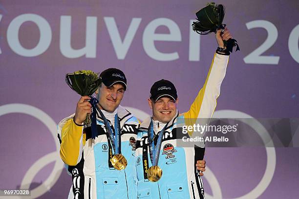 Kevin Kuske and Andre Lange of Germany receive the gold medal during the medal ceremony for the men's two-man bobsleigh on day 11 of the Vancouver...