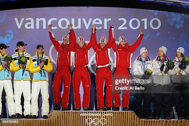 The German team receive the silver medal, the Austrian team receive the gold medal and the Norwegian team receive the bronze medal during the medal...