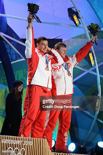 Alexey Voevoda and Alexsandr Zubkov of Russia receive the bronze medal during the medal ceremony for the men's two-man bobsleigh on day 11 of the...