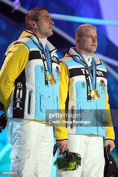 Kevin Kuske and Andre Lange of Germany receive the gold medal during the medal ceremony for the men's two-man bobsleigh on day 11 of the Vancouver...