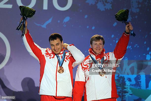 Alexey Voevoda and Alexsandr Zubkov of Russia receive the bronze medal during the medal ceremony for the men's two-man bobsleigh on day 11 of the...