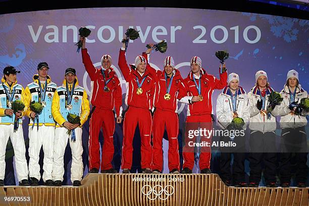 The German team receive the silver medal, the Austrian team receive the gold medal and the Norwegian team receive the bronze medal during the medal...
