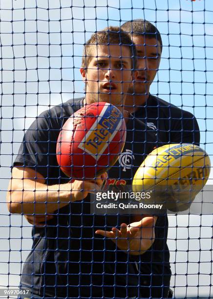 Marc Murphy of the Blues handballs during a Carlton Blues AFL training session at Visy Park on February 23, 2010 in Melbourne, Australia.