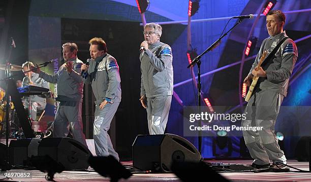 Josh Freese, Bob Casale, Gerald Casale, Mark Mothersbaugh and Bob Mothersbaugh of Devo perform at the medal ceremony on day 11 of the Vancouver 2010...