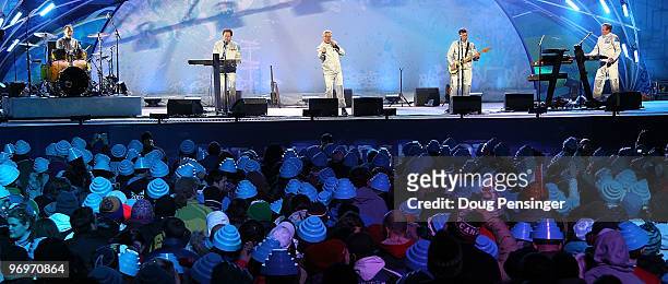 Josh Freese, Bob Casale, Gerald Casale, Mark Mothersbaugh and Bob Mothersbaugh of Devo perform at the medal ceremony on day 11 of the Vancouver 2010...