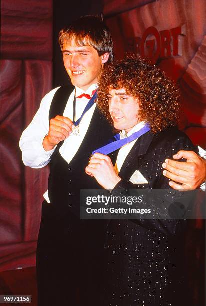 Tony Lockett of St Kilda and John Platten of the Hawthorn Hawks pose with the 1987 Browlow Medal in Melbourne, Australia.