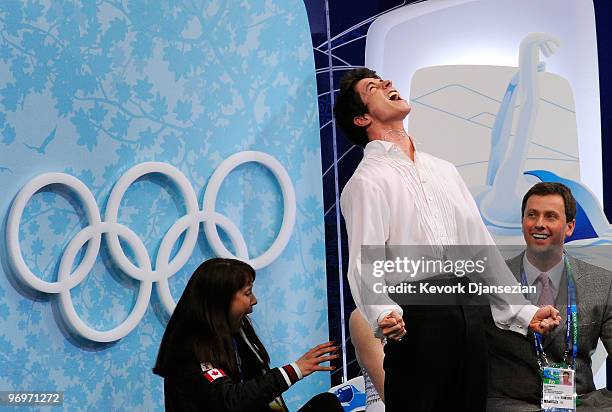 Tessa Virtue and Scott Moir of Canada celebrate after receiving their scores for the free dance portion of the Ice Dance competition on day 11 of the...