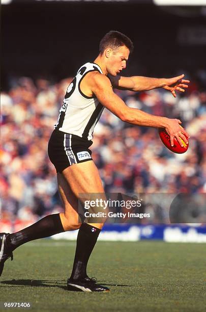 Saverio Rocca of the Collingwood Magpies lines up a kick for goal in Melbourne, Australia.