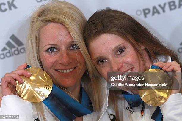 Claudia Nystad and Evi Sachenbacher-Stehle of Germany pose with the gold medal for the women's team sprint cross-country skiing on day 11 of the...