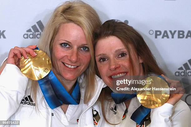 Claudia Nystad and Evi Sachenbacher-Stehle of Germany pose with the gold medal for the women's team sprint cross-country skiing on day 11 of the...
