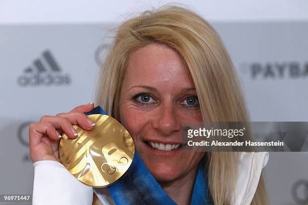 Claudia Nystad of Germany poses with the gold medal for the women's team sprint cross-country skiing on day 11 of the Vancouver 2010 Winter Olympics...