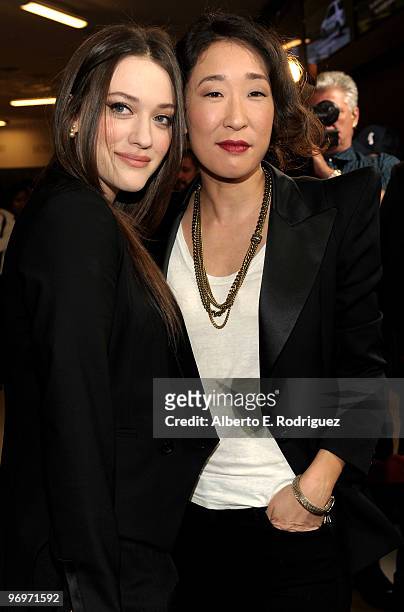 Actress Kat Dennings and actress Sandra Oh arrive at the premiere of Darius Films' "Defendor" on February 22, 2010 in Los Angeles, California.