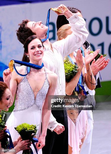 Tessa Virtue and Scott Moir of Canada pose with their gold medal after they won the Ice Dance competition on day 11 of the 2010 Vancouver Winter...