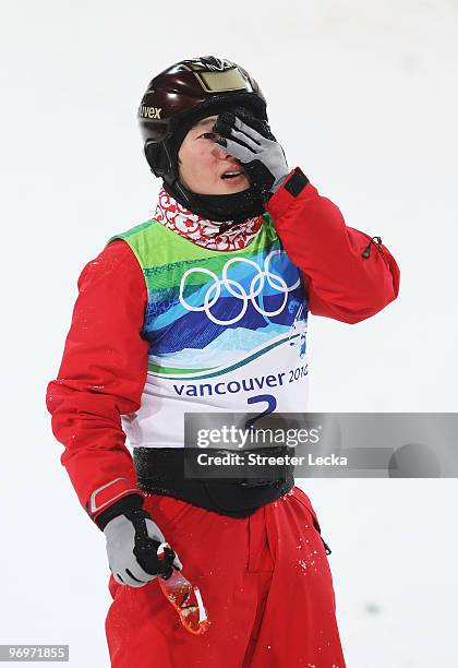 Qi Guangpu of China reacts after his second jump during the freestyle skiing men's aerials qualification on day 11 of the Vancouver 2010 Winter...