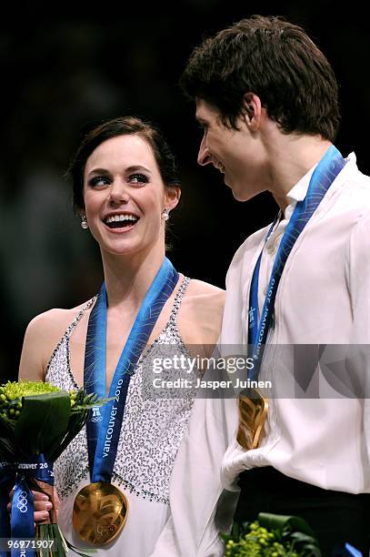 Tessa Virtue and Scott Moir of Canada pose with their gold medal after they won the Ice Dance competition on day 11 of the 2010 Vancouver Winter...